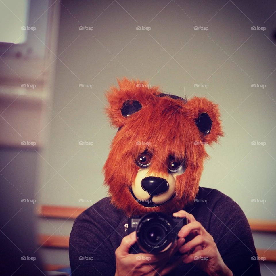 Bear taking photos with a  Fujifilm camera, using a camera to make money, using the Foap app to make money, selling photos on Foap, focusing the camera on Foap, Foap app sells photos to brands, selling digital media, Bear masks and cameras 