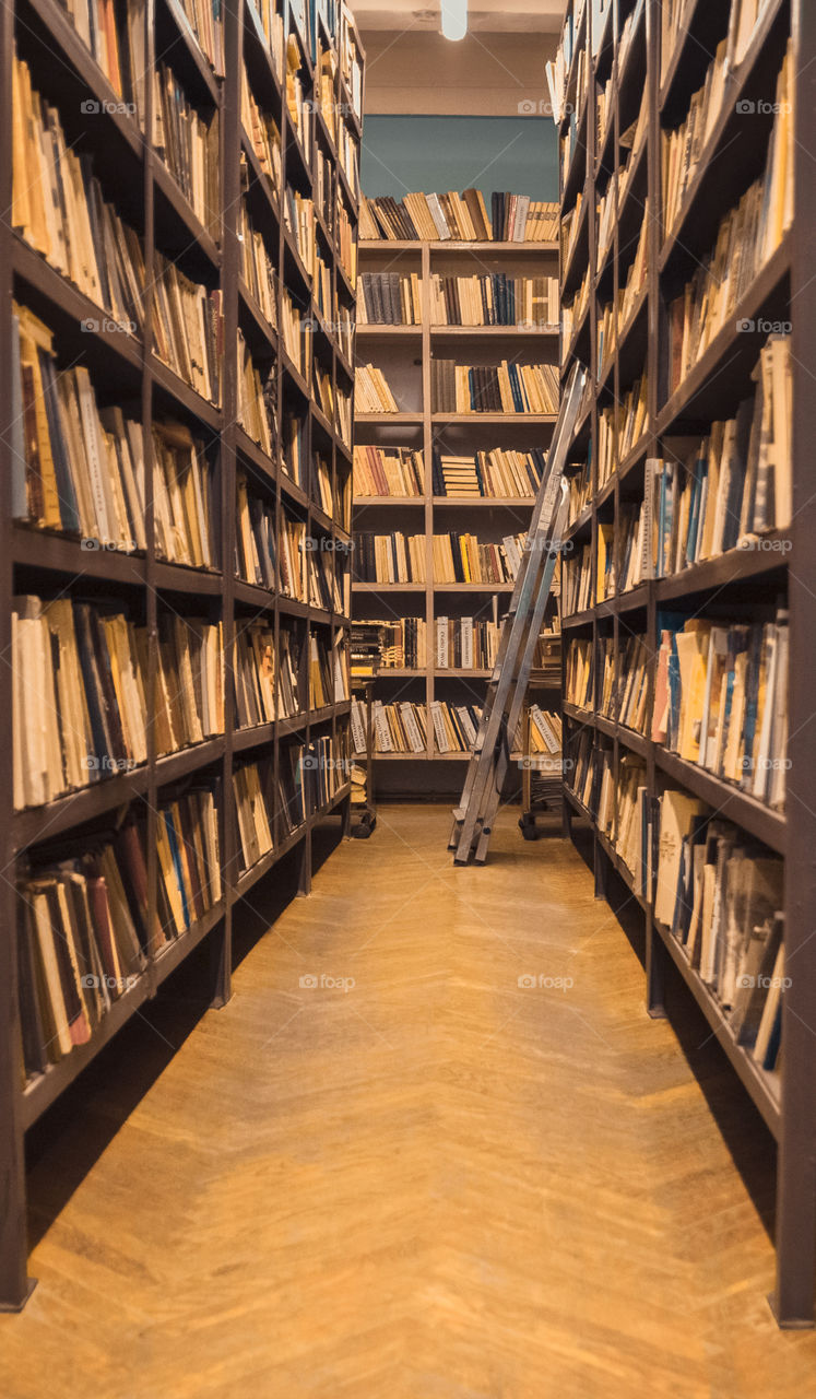 brown library shelves racks