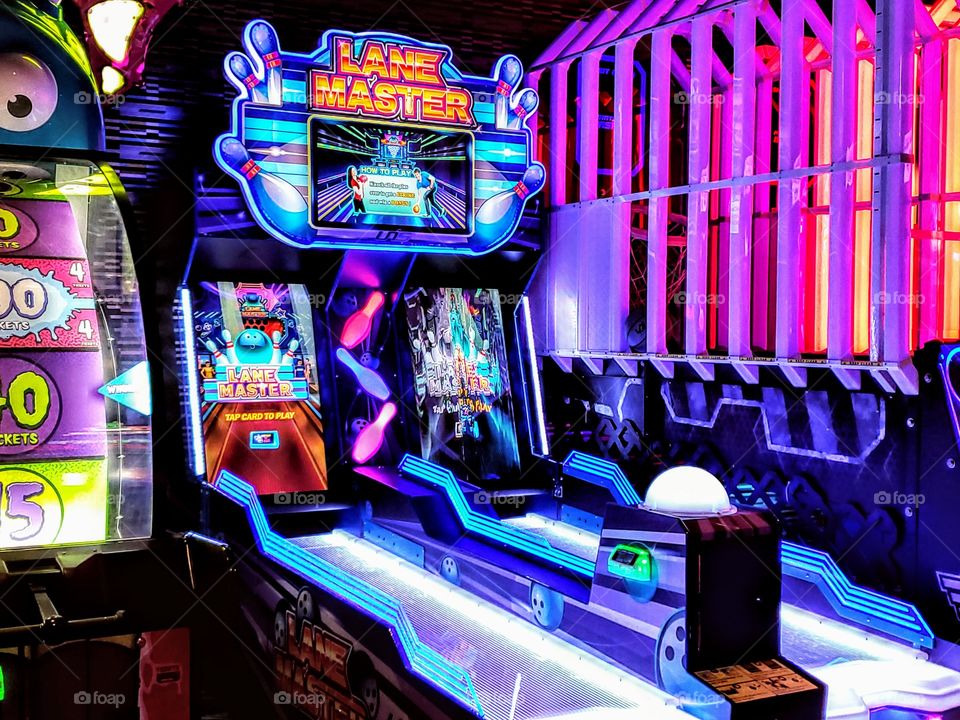 Colorful bright arcade with neon lights and shapes and lines everywhere.