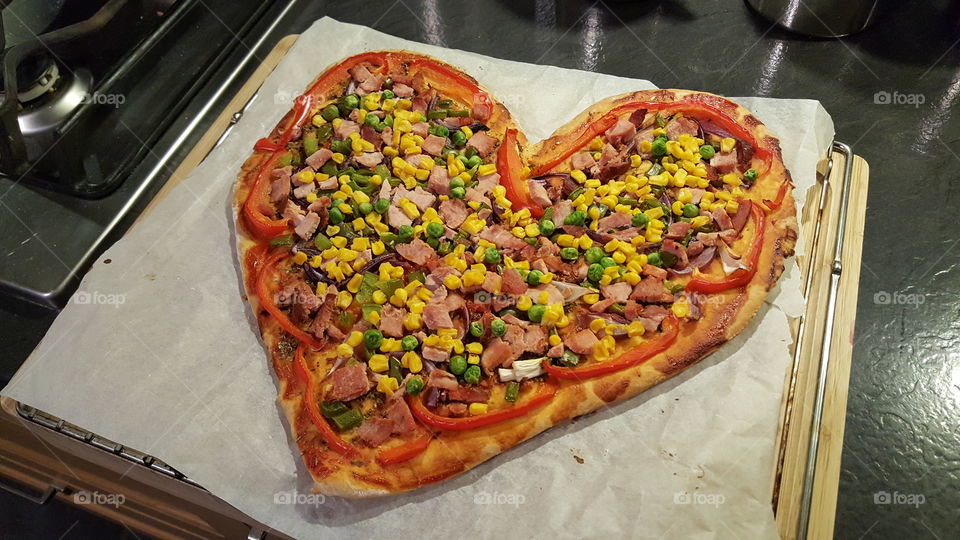 Home made pizza in heart shape