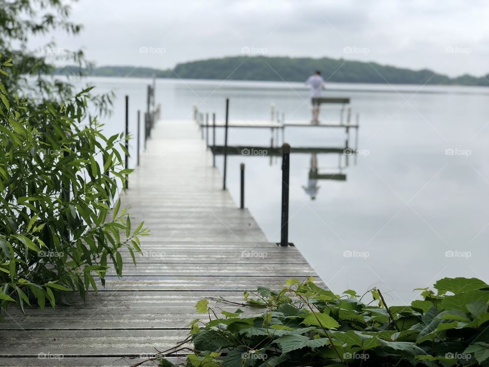 Dock on a serene lake. Land of 10,000 lakes. Minnesota summertime 