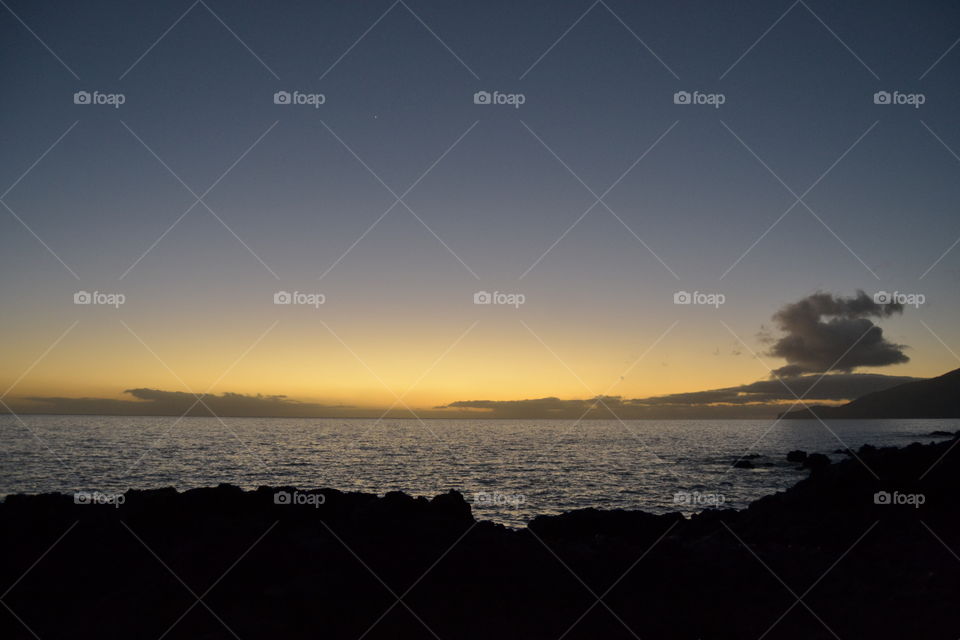 Sunset on vulcanic island