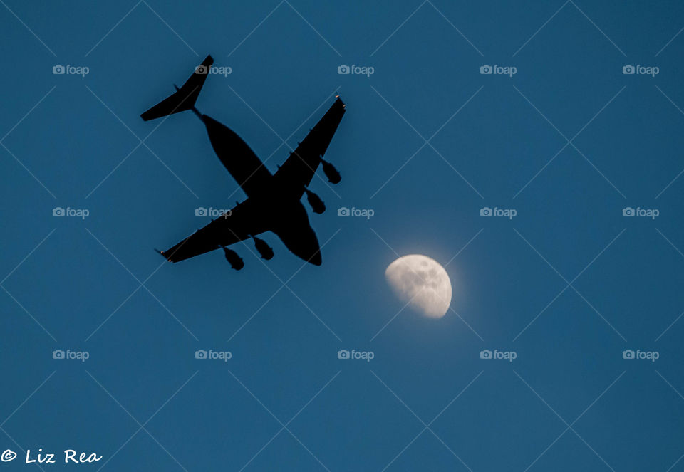 Plane across the moon