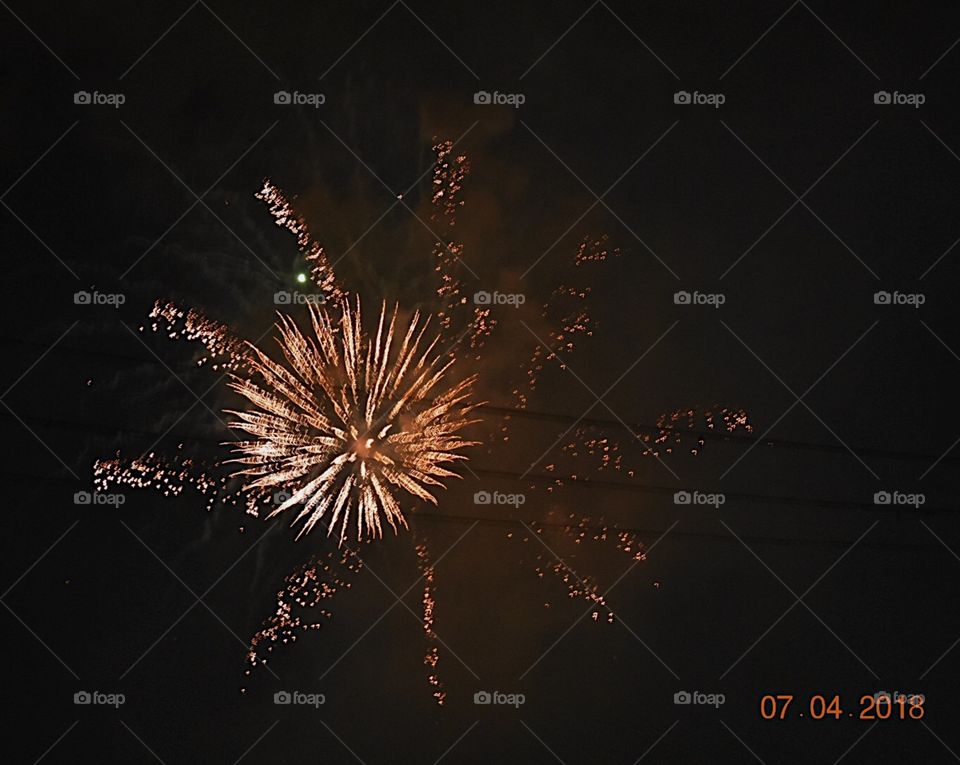 A far off shot showing the destructive yet beautiful powers a firework possesses. 
