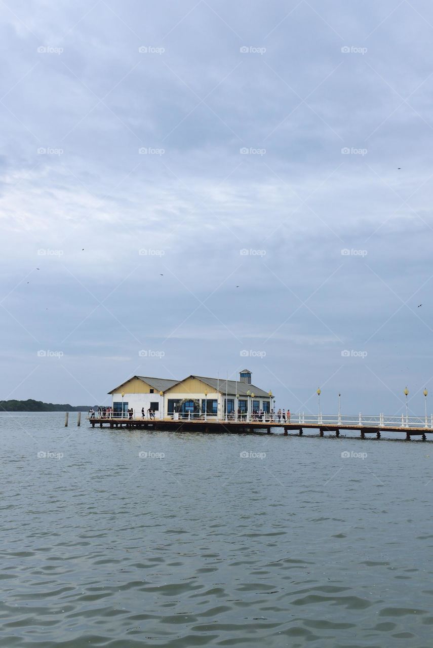 Wharf with house at the end over the sea