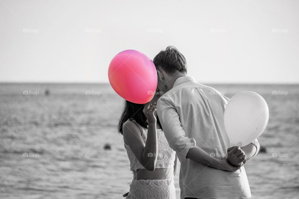 Young couple so sweet at the beautiful beach of Thailand