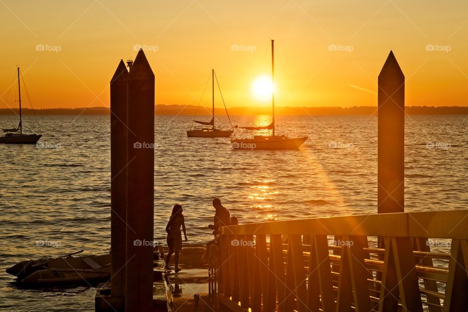 Silhouetted harbor during sunset