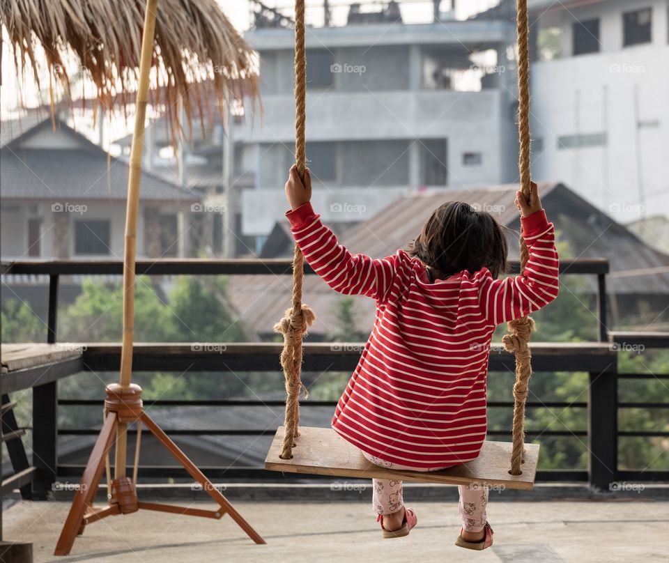 Cute girl play swing