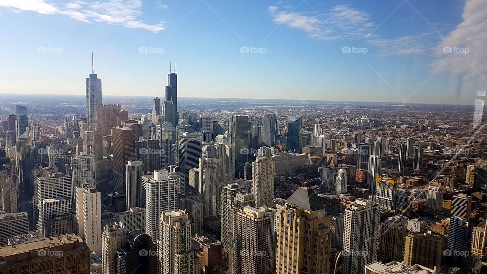 Chicago skyline panoramic day view from Willis Tower. Chicago City skyscrapers view inside observation floor at Sears Tower.