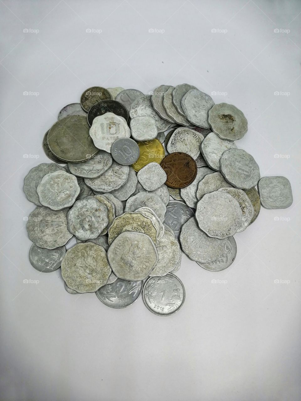 Heap of Money or coins on white background.