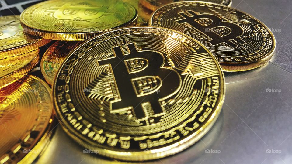 Close up on Gold bitcoin on keyboard 