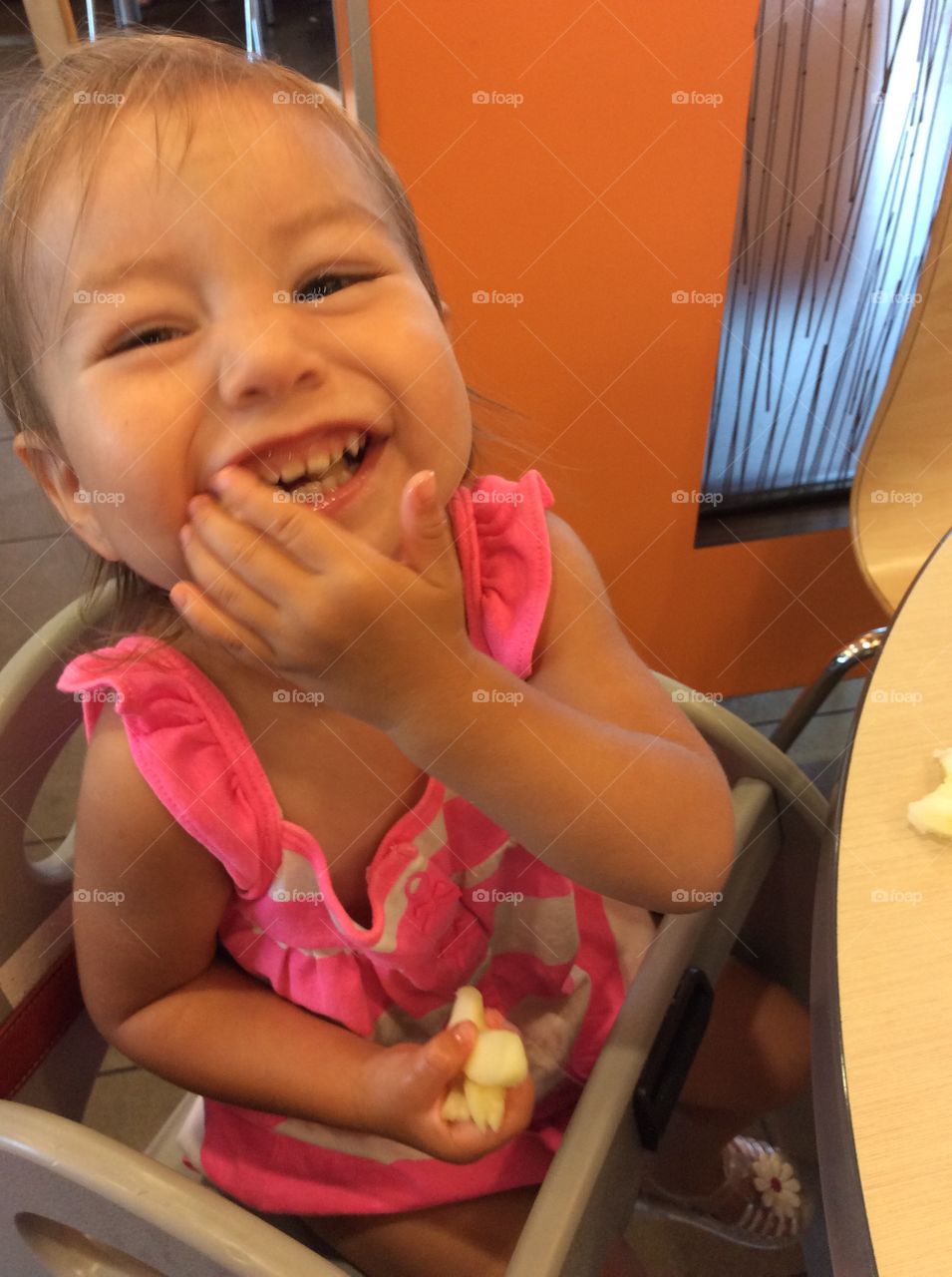 Baby girl enjoying apples