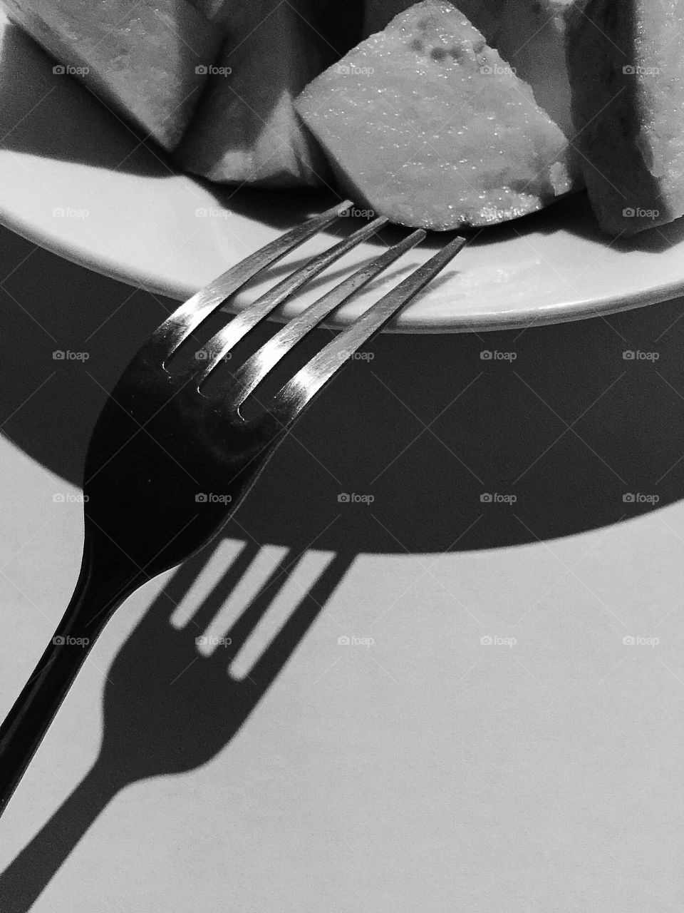 A fork and a plate of guava