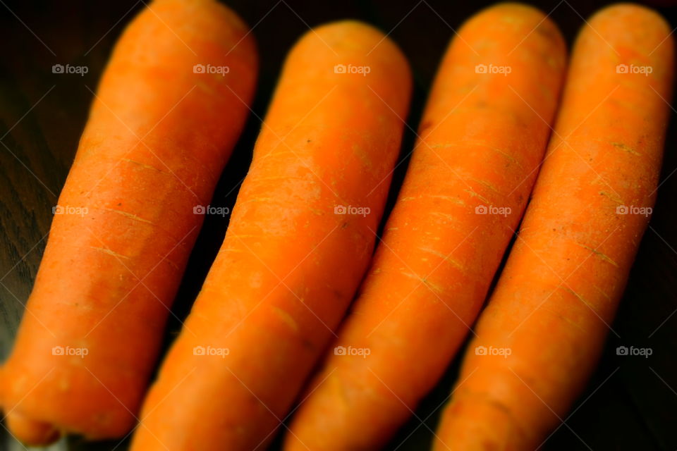 Bright orange carrots close up