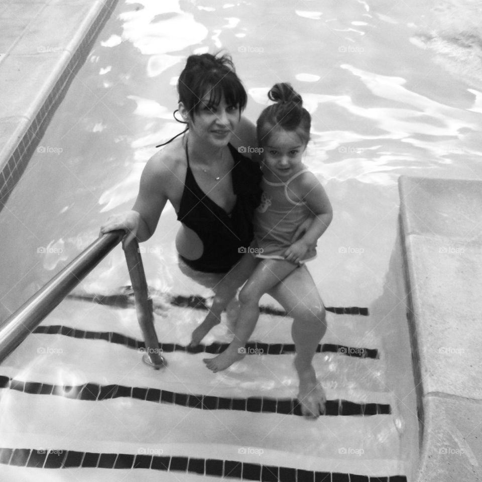 Pool Pose. Mother and small girl in a hotel pool. 