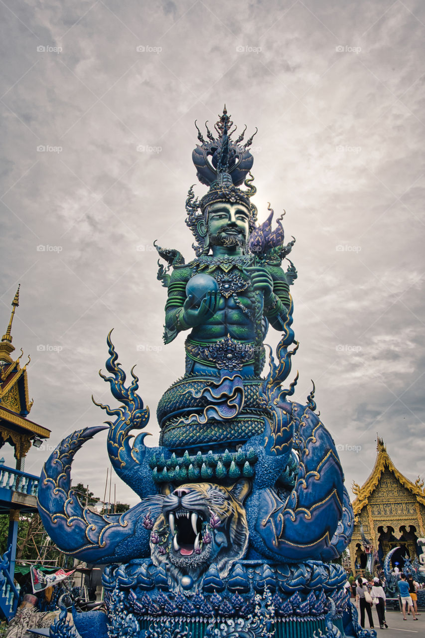 Beautiful Statue outside the Blue Temple in Chiang Rai, Thailand