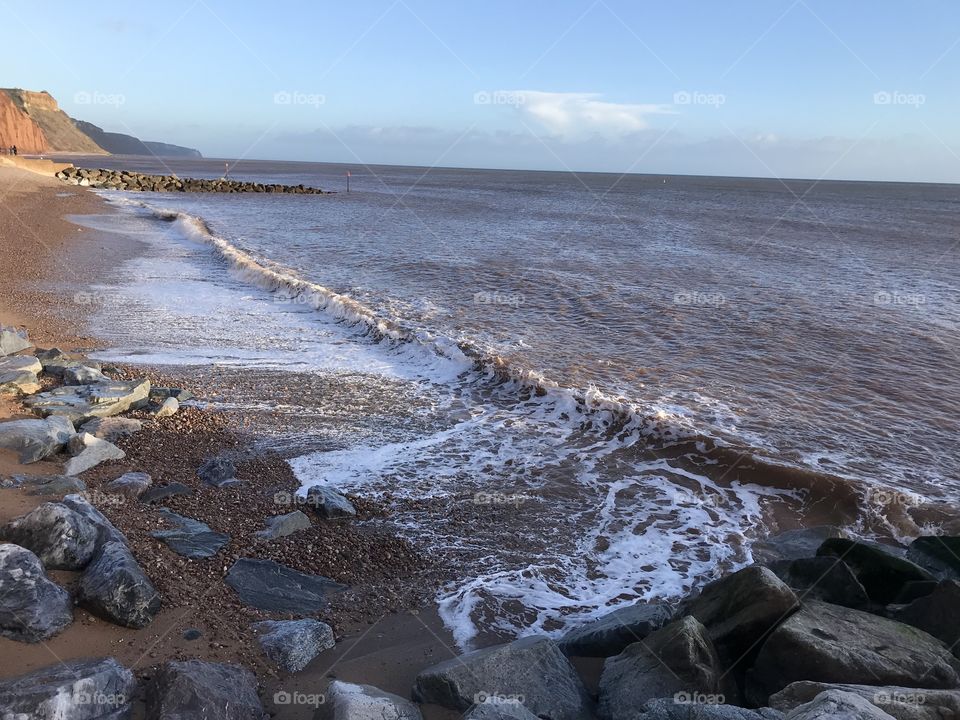 Rough sea add to the atmosphere of a chilly but sunny resort attraction.