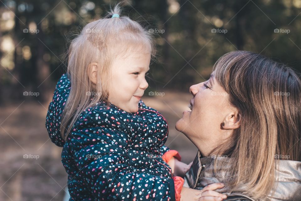 smiling mom and daughter