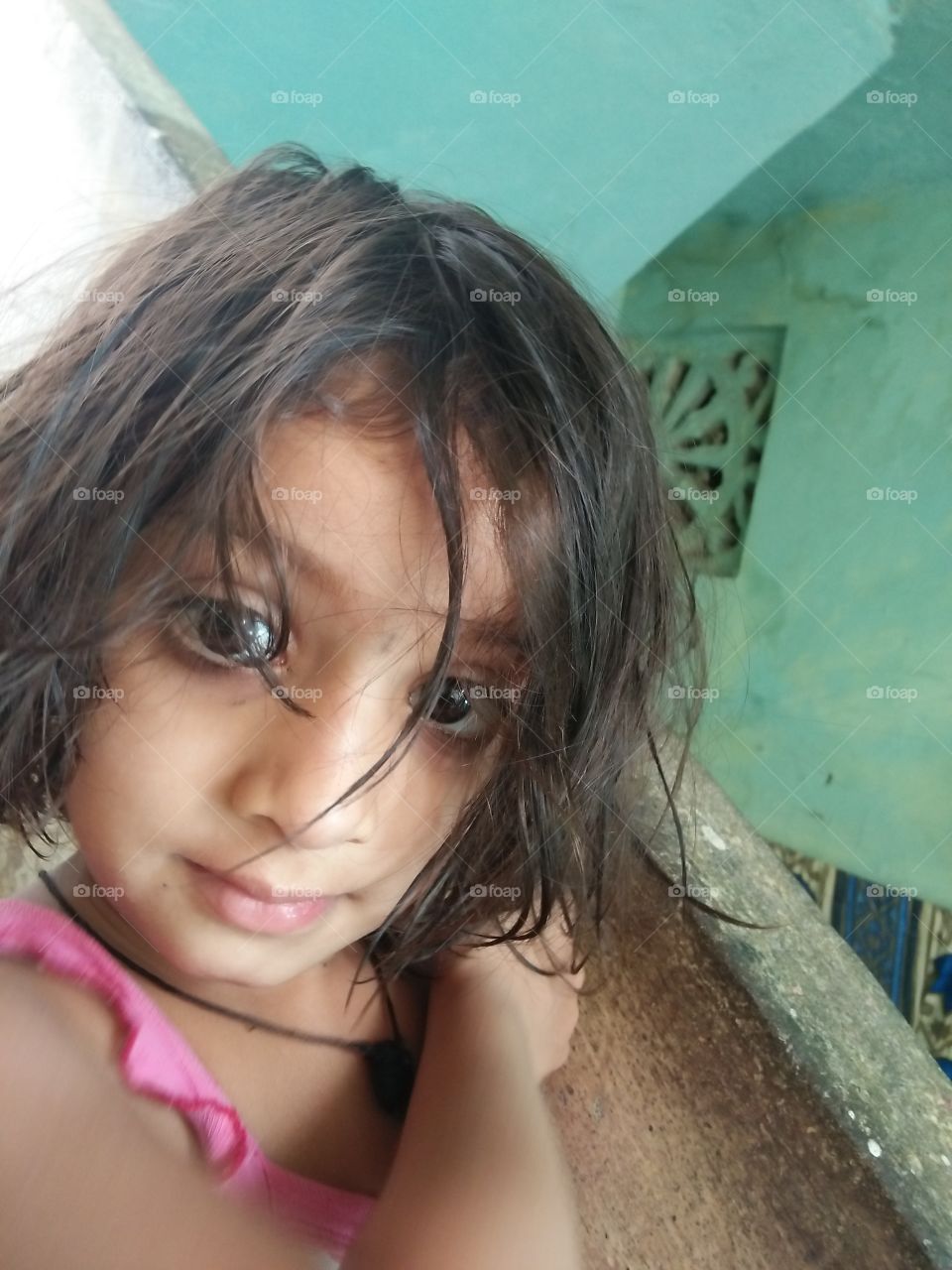Close-up of a indian girl with messy hair