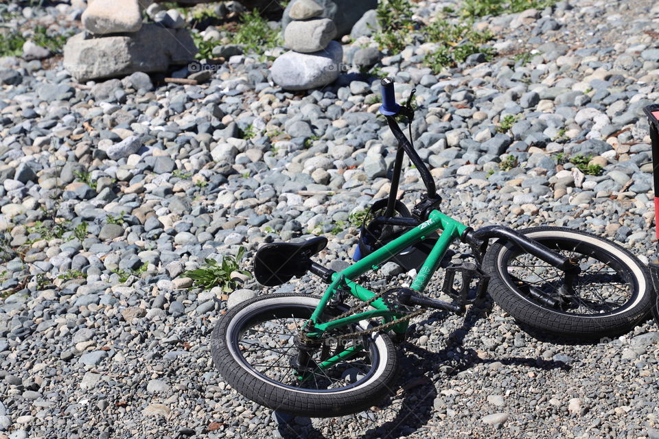 Bike laid on the rocks