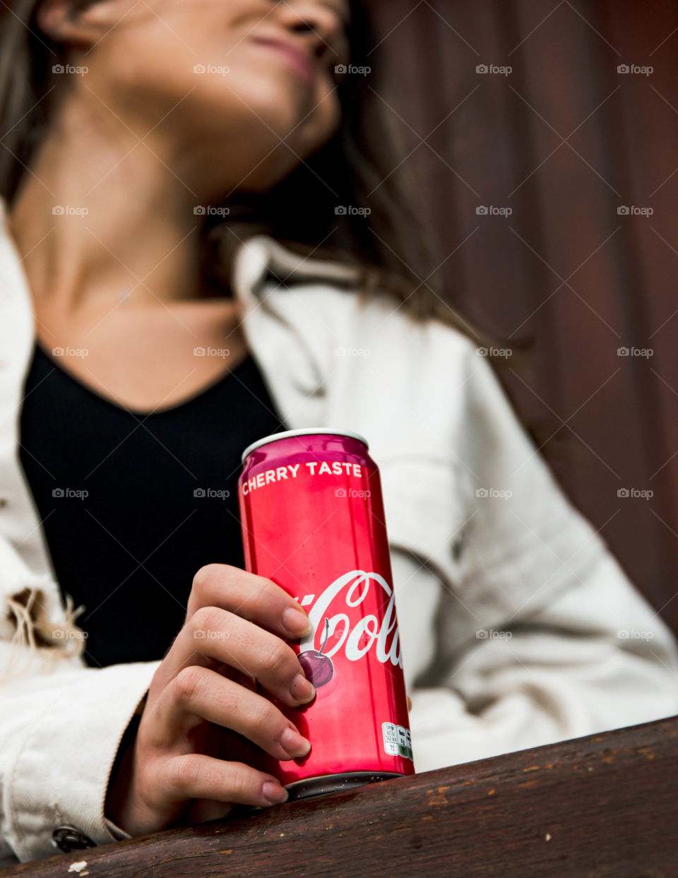 Close up shot to a coca cola can.