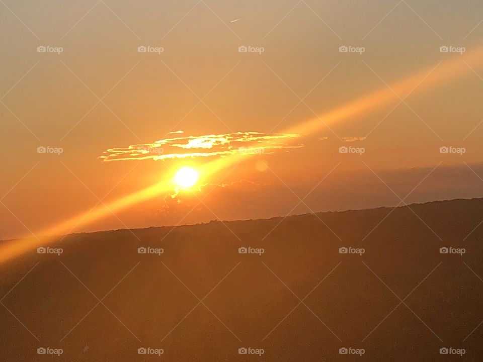 Orange sunset with Horizontal Sunbeams