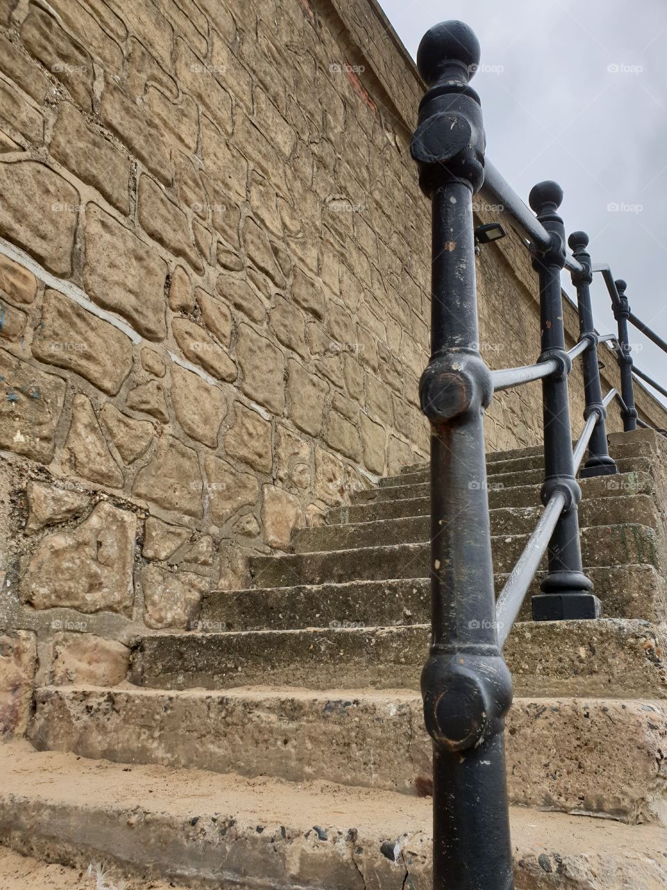 stone carved steps with iron railings
