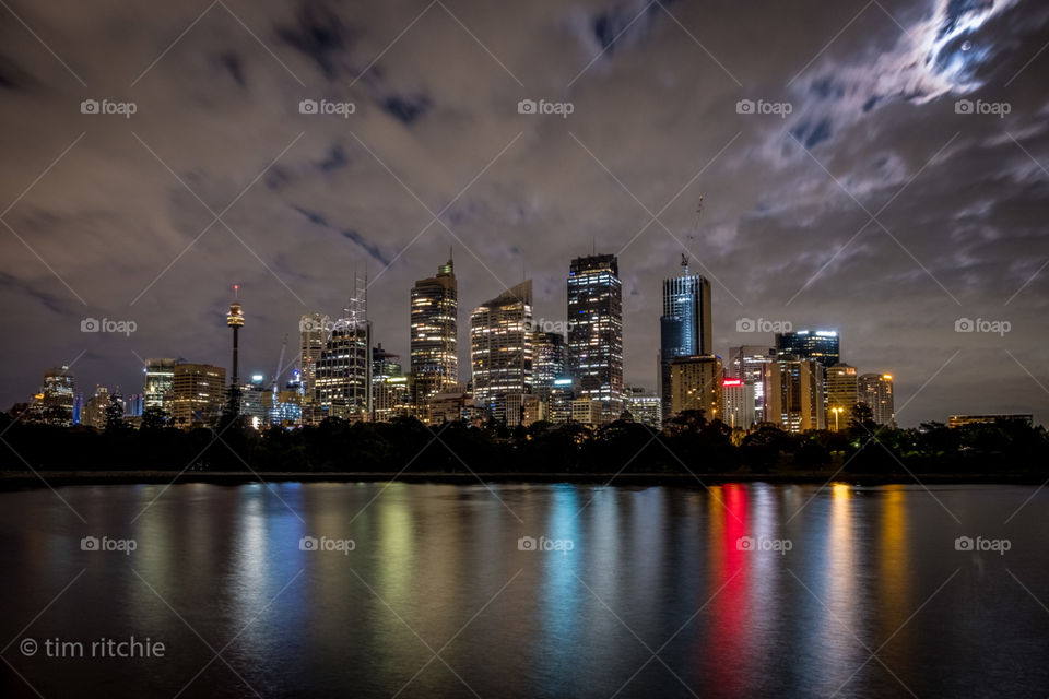 On a cloudy pre dawn morning, as I look across Camp Cove to the Sydney City, the moon tries to peek out from the clouds. It doesn’t feel like spring today.