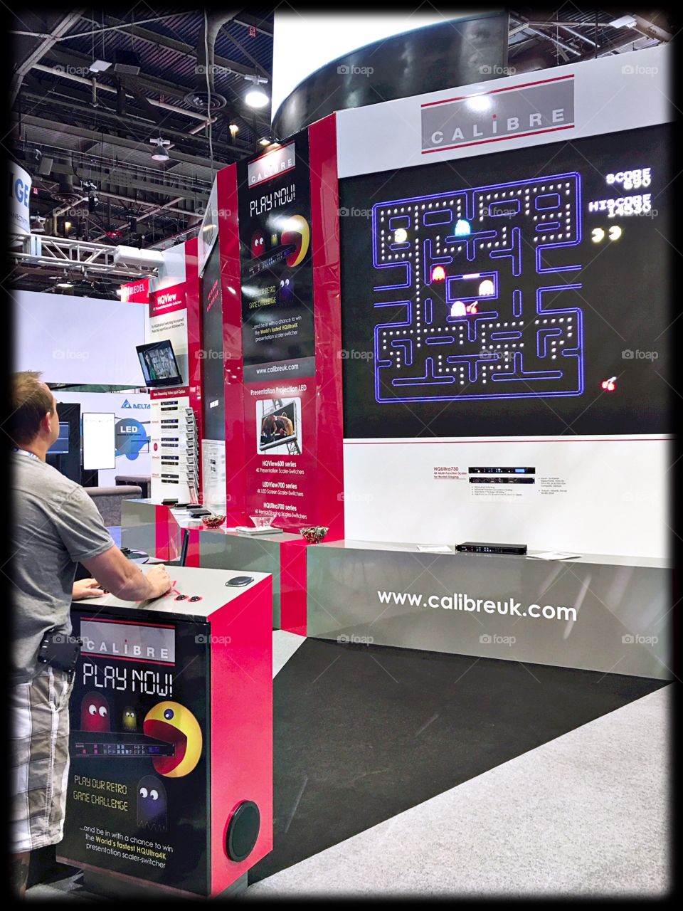 Playing Pac Man on a video wall at a trade show in Las Vegas