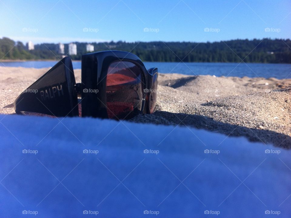 Shades on the beach. Sunglasses on the beach