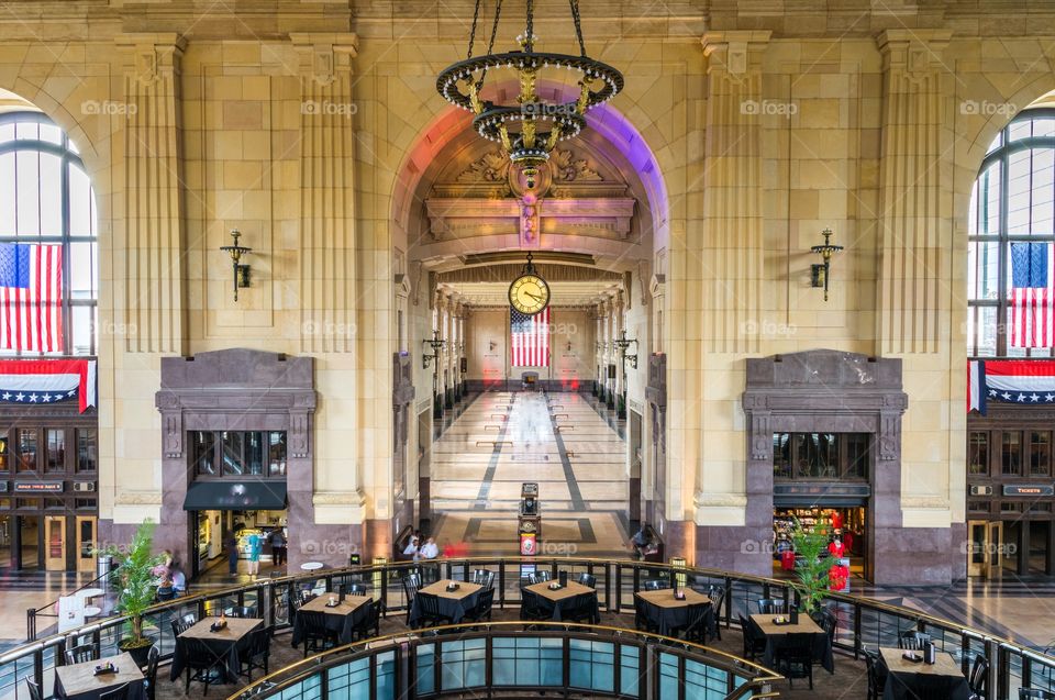 Horizontal photo of the main hall of the Kansas City, MO Union Station (all business names/logos and people blurred or edited out)