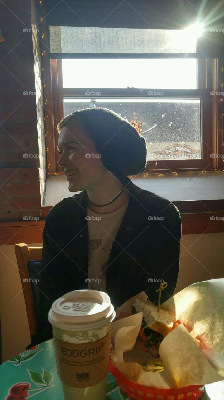 girl laughing in a cafe