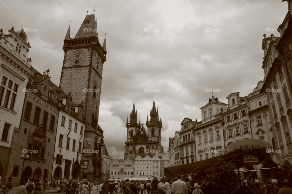 Prague Townhall and Tyn church in black and white on a cloudy afternoon.