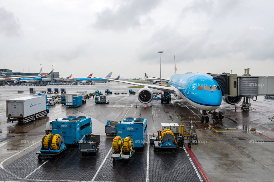 Royal Dutch Airlines airplanes parked at the gate of Amsterdam Schiphol Airport