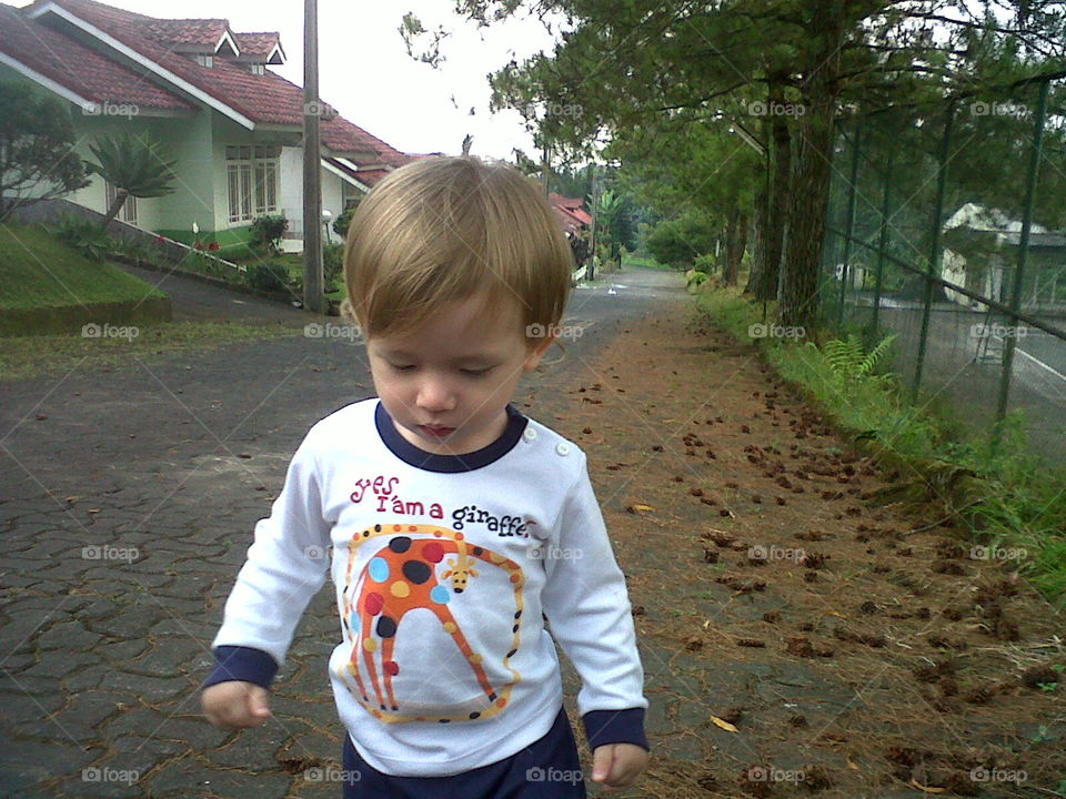 Child walking up the road