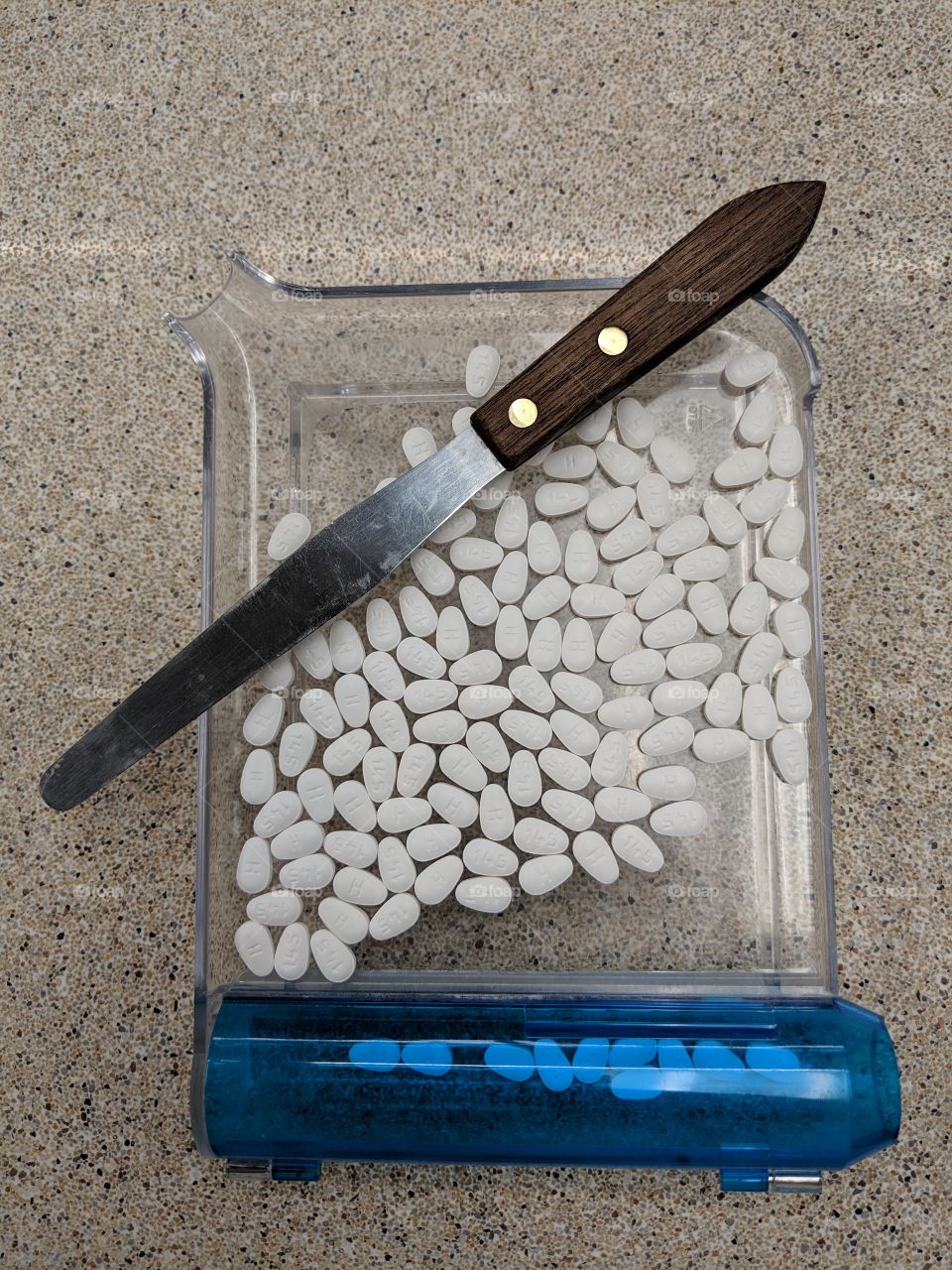 white tablets on counting tray