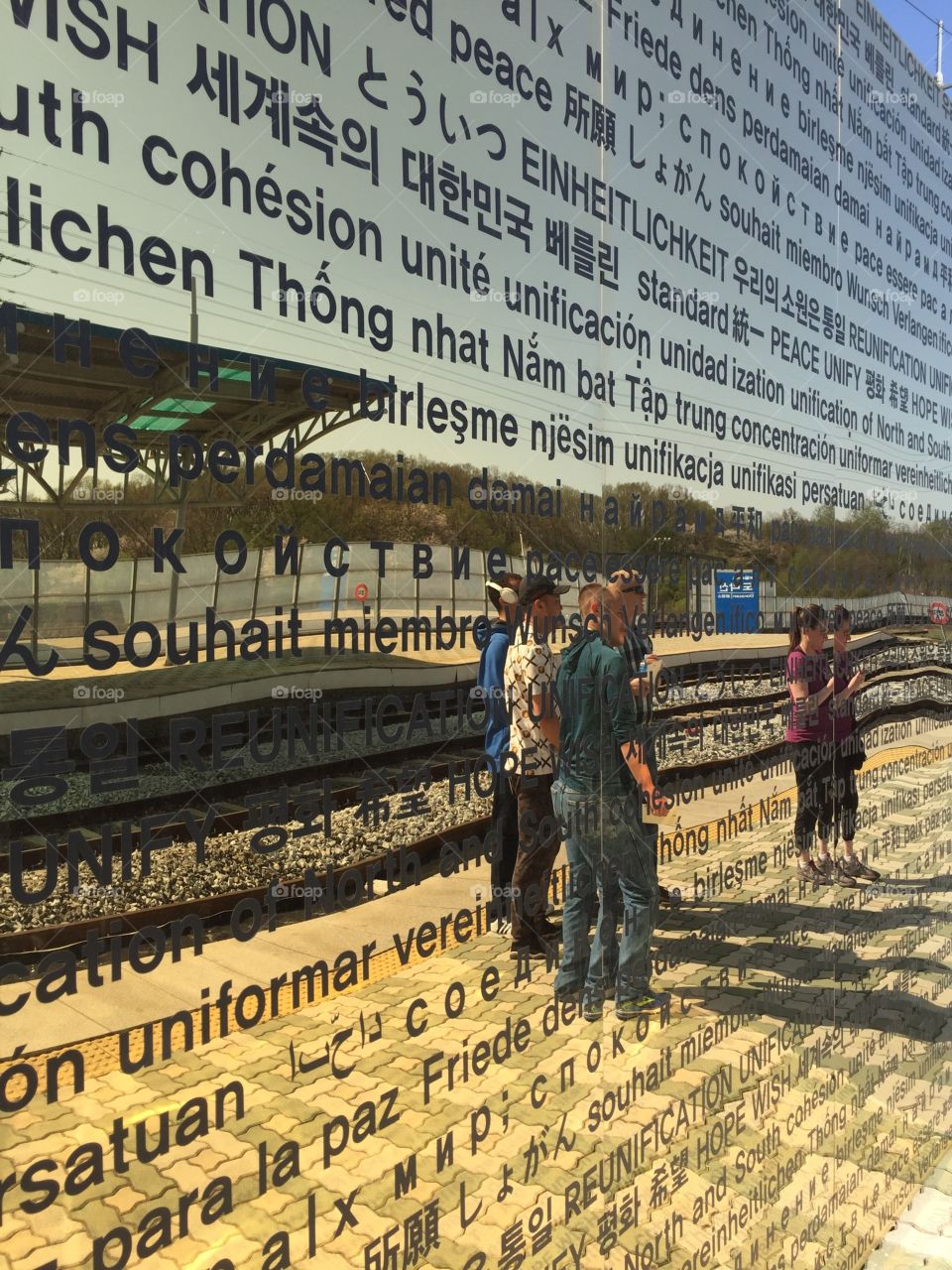 'Unification'
Located at Dorasan Station, the last train station before North Korea. This wall is inscribed with the word 'Unify' in different languages. It's placed before a piece of the Berlin Wall.