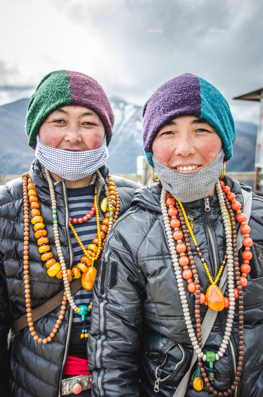 Two lovely locals on XueBao mountain, Sichuan, china 