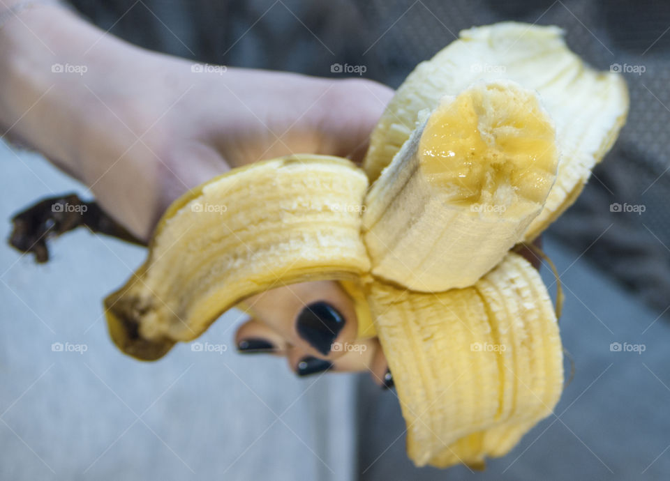 Banana in the hands of a girl