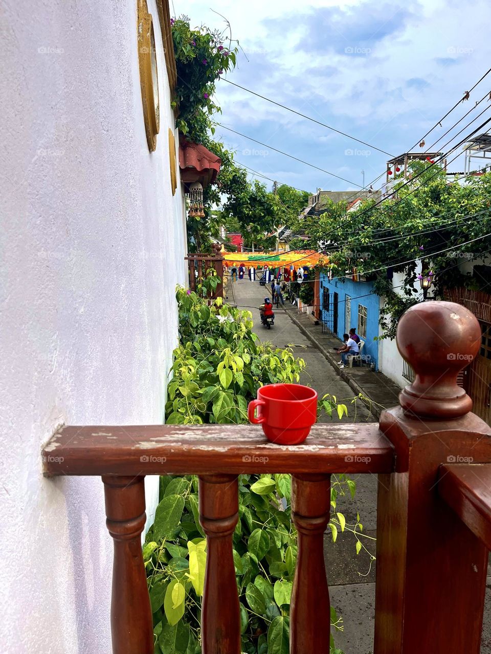 A glimmer relaxing moment enjoyed a cup of coffee in the balcony 