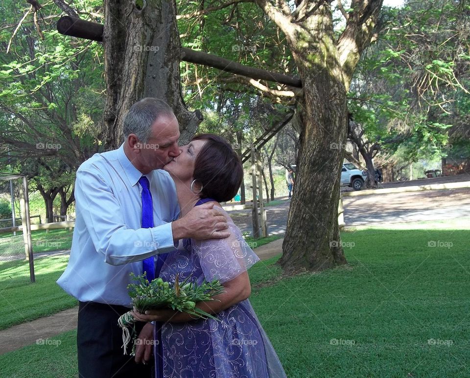 Groom and bride, kissing