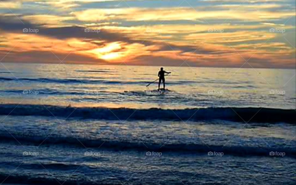 lone paddle boarder