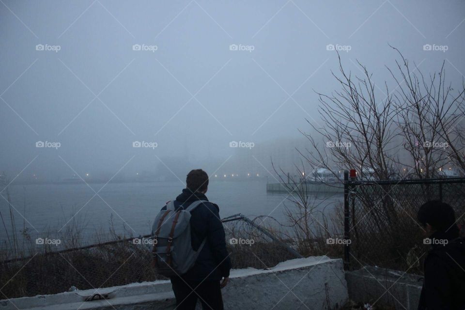 observer looking over the foggy industrial city in brooklyn 