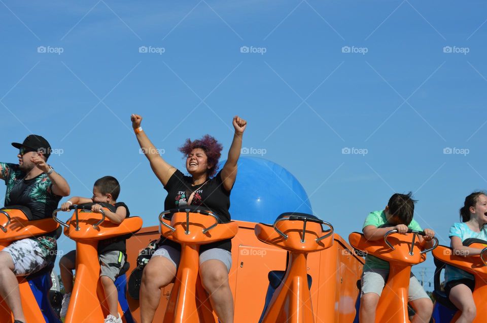 have fun when you can, girl riding rollercoaster