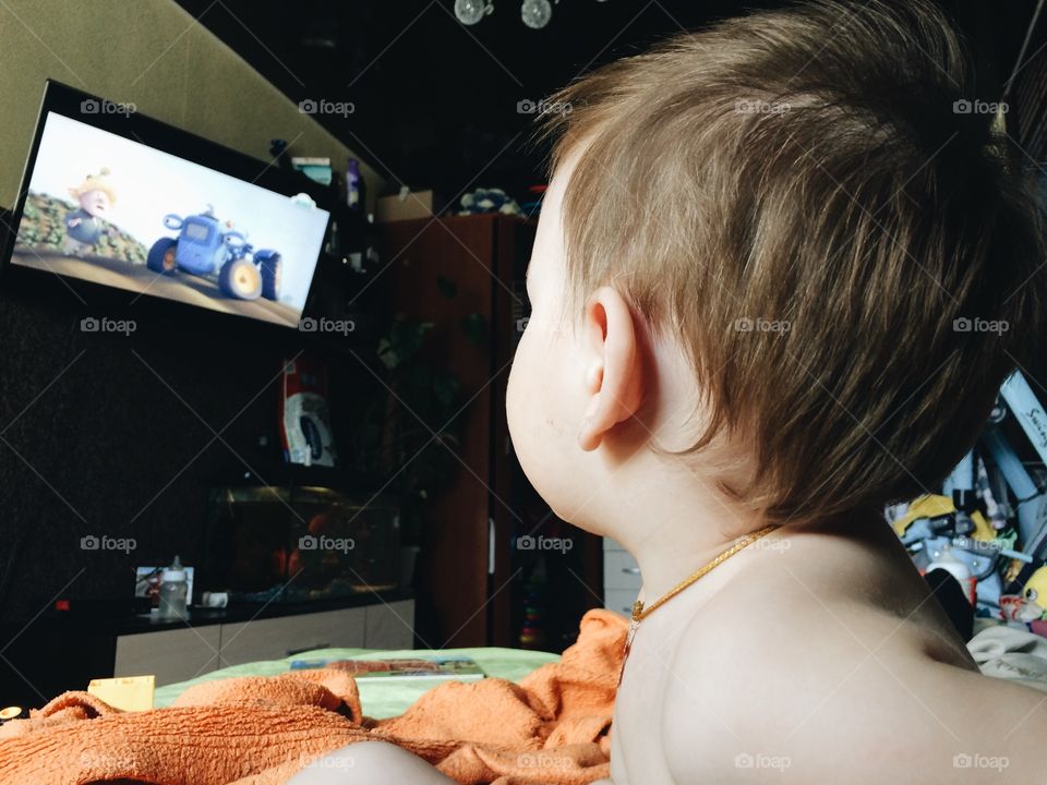 Boy watching a tv