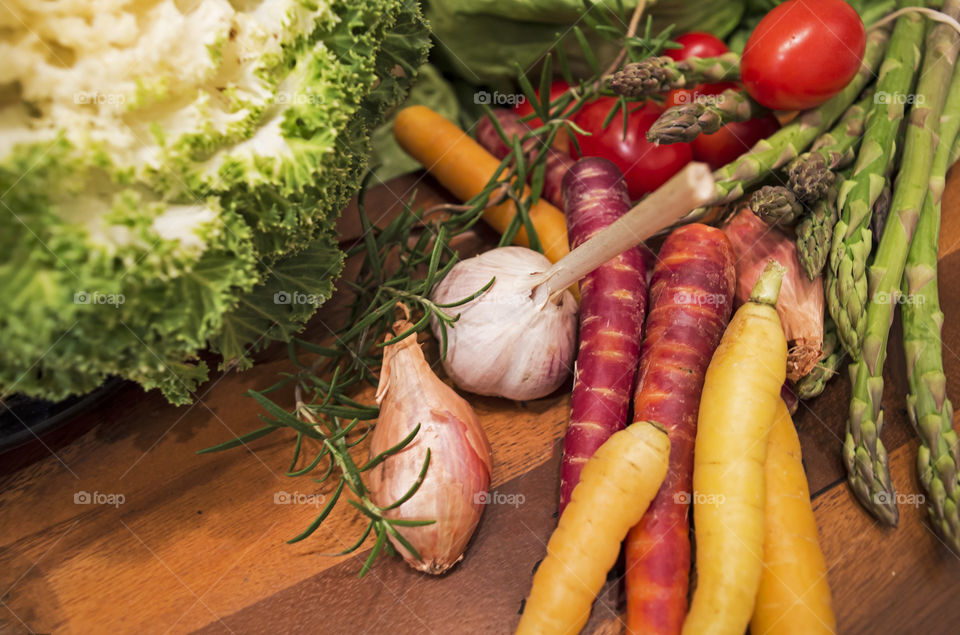 Autumn harvest vegetables on wood cutting board healthy fall cooking conceptual background 