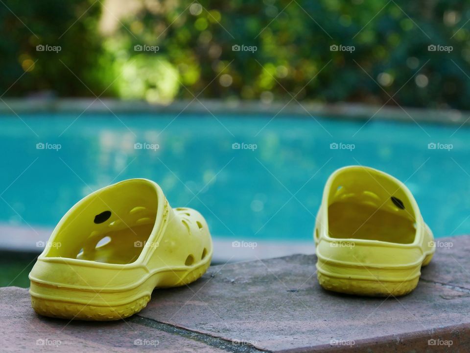 Yellow shoes on poolside