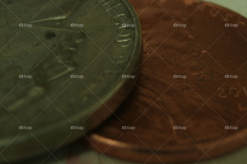 macro photography of nickel and penny