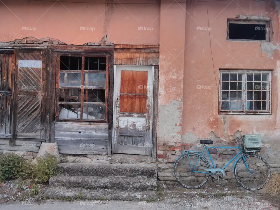 old bicycle on old facade