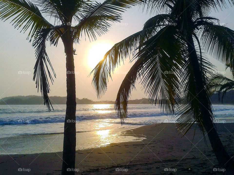 Sunset in Puerto Carrillo or Playa Carrillo is a small coastal town that belongs to the province of Guanacaste on the Pacific coast of Costa Rica. Constitutes the third district of the canton of Hojancha and is located about 5 km from Sámara beach